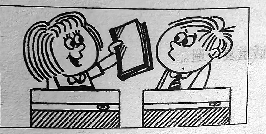 A girl holds up a book beside a boy.