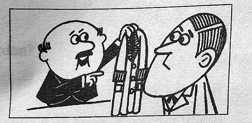 A man holds up a coat to another man.