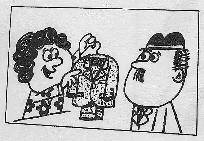 A woman holds up a suit to a man.