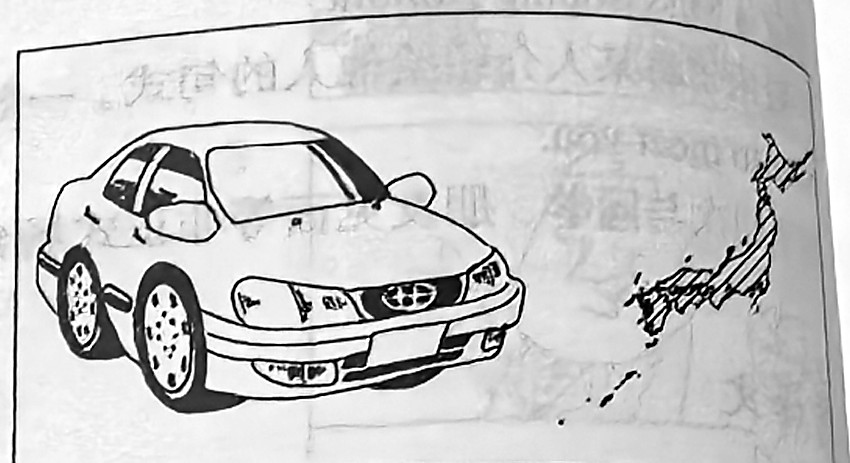 A Toyota beside a map highlighting Japan.