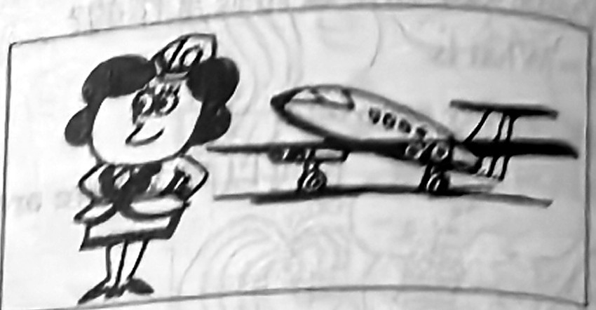 An air hostess stands beside an aeroplane.