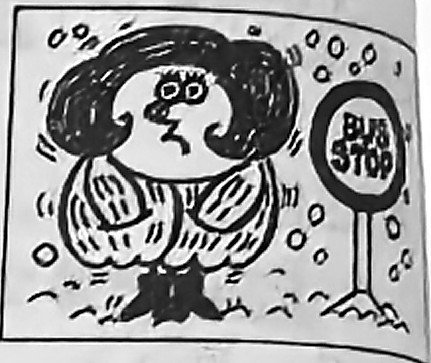 Emma shivers in the cold beside a bus stop.