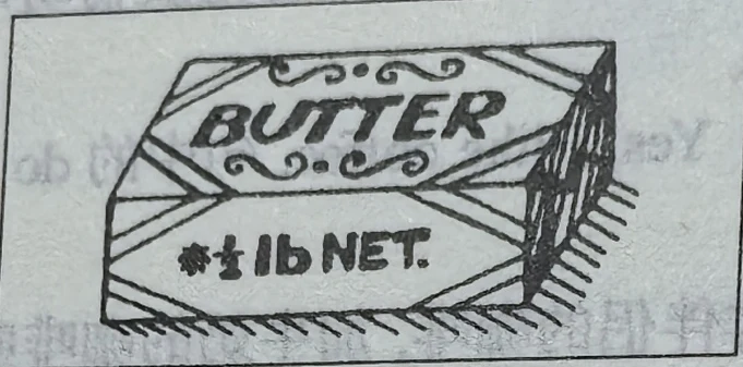 A butter packet labelled BUTTER and 1 LB NET.