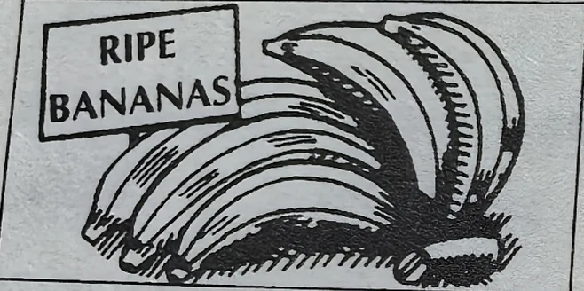 A bunch of bananas with a RIPE BANANAS sign.