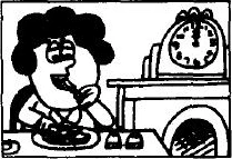 A person eats at a table beside a clock.