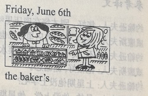A baker stands behind a counter of loaves and pastries; a customer points at the goods. Caption: 'Friday, June 6th / the baker's'.