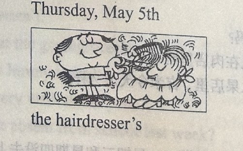 A hairdresser with a comb and scissors grooms a seated customer's long, wavy hair. Caption: 'Thursday, May 5th / the hairdresser's'.