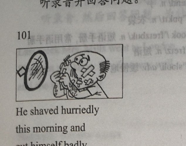 A bald man with a cross-shaped bandage on his face shaves hurriedly in front of a hand mirror; band-aids cover his arms.