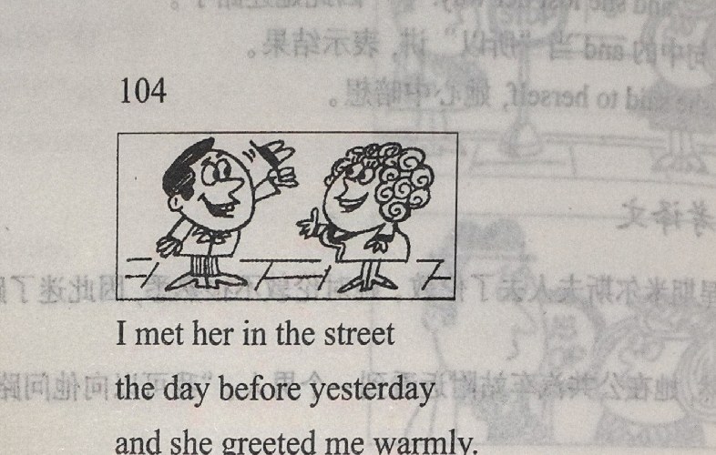 A man and a woman meet in the street and greet each other warmly.