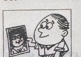 A man looks at a framed photograph.